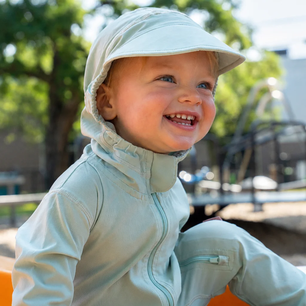 Toddler in the Frosty Green TrailTog UPF 50+ sunsuit